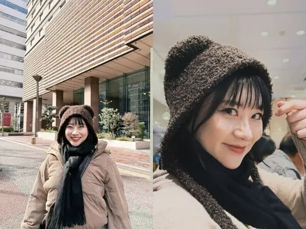 头戴深褐色熊耳朵毛帽的焦凡凡,身着卡其色灯芯绒羽绒外套,挺着明显孕肚在日本街头,模样俏皮可爱